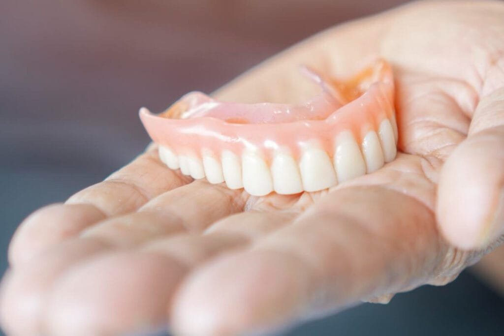 Removable dentures and prosthodontic care